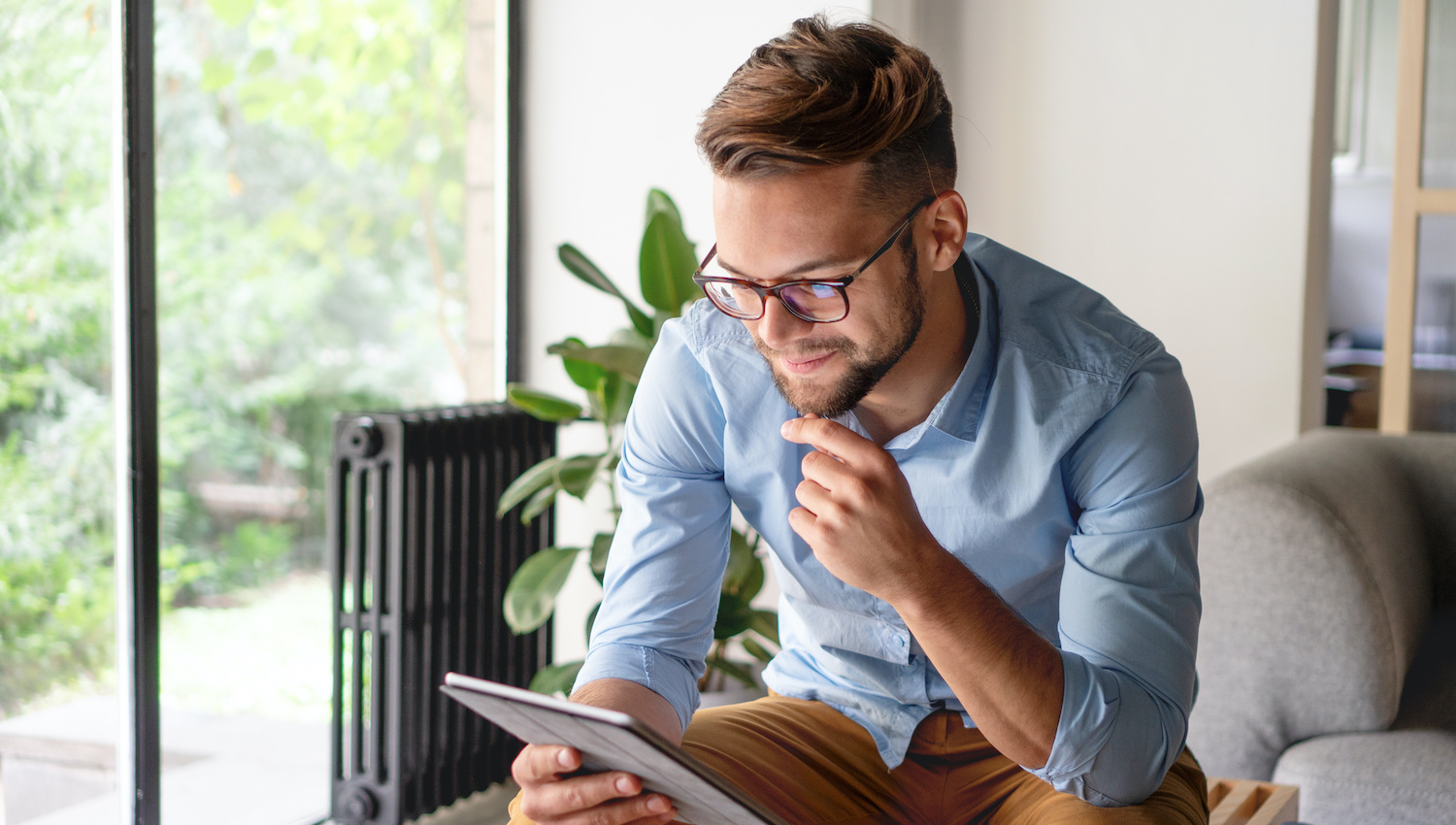 Young Man looking at digital tablet