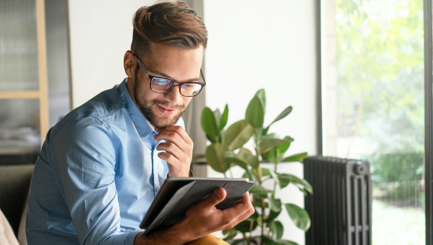 Young Man holding digital tablet